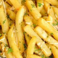 Garlic Parm Fries · Buttery garlic sauce & parmesan cheese.