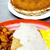 Chicken Fried Chicken · Fried Chicken Breast, two  eggs, country potatoes, and pancakes (gravy by request).