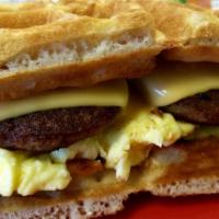 Moyo Waffle Sandwich 1/2 · Breakfast meat, waffle, eggs, & cheese.
