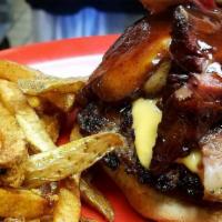 Brisket Burger · Brisket, patty, cheese, and bbq sauce on toasted buns .