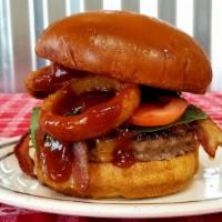 Bbq Burger · Half pound Angus Beef, cheddar cheese , bacon and  BBQ sauce, in a brioche bun.