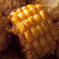 Fried Corn · Fried corn comes with butter, traditional seasoning and cheese on it.