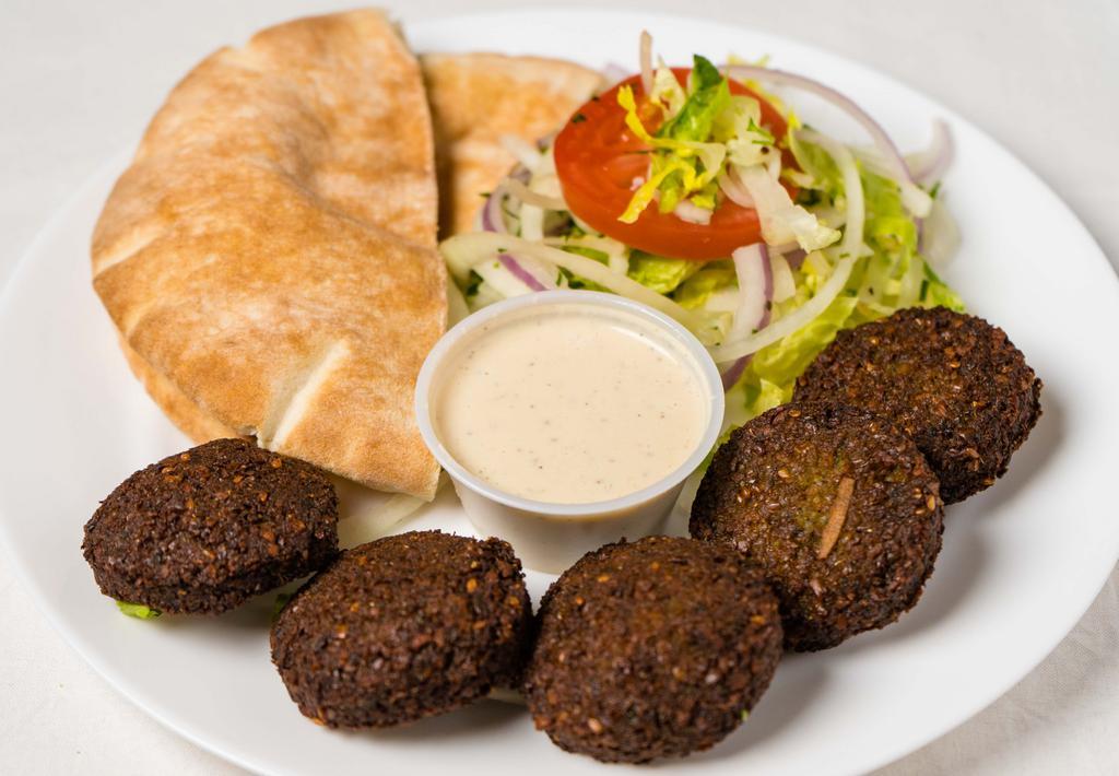 Falafel · Ground chickpeas blended with fresh onions and parsley. Contains gluten. Served with tahini sauce which contains dairy.