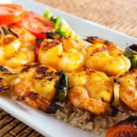Shrimp Kebab · Grilled jumbo shrimp marinated with garlic, black pepper, and olive oil. Marination contains...