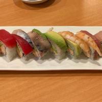 Rainbow Roll · Tuna, salmon, white fish,shrimp, crab stick, mackerel, avocado on top of a California roll.