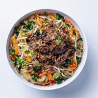 Noodles · Delicious chewy noodles tossed with kale, carrots, roasted sesame seeds, and a garlic-ginger...