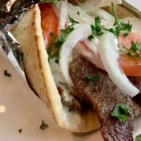 Lamb Gyros · Classic rotisserie gyros with onion, tomato, and homemade tzatziki. Served with Artemis fries.