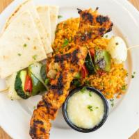 Souvlake Plate - Chicken · Greek style kebabs served with vegetables, saffron apricot rice pilaf with toasted almonds, ...