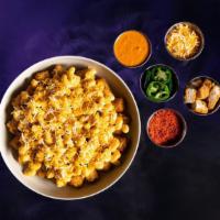 One Hit Bowl · We give you the base, you build the rest! Bed of perfectly crispy, seasoned potato tots topp...