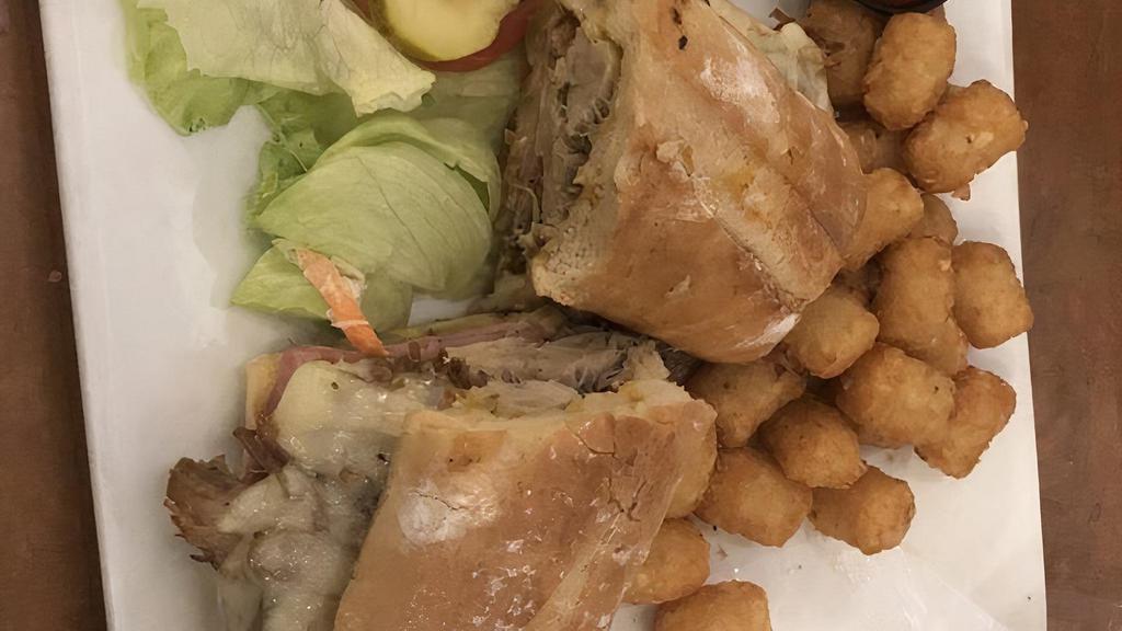 Pressed Cuban Sandwich · With swiss cheese, ham, pickles and mustard. Served with pickle, house made slaw, and choice of potato ( french fries, hand cut sweet potato fries or tots) or plantain chips.