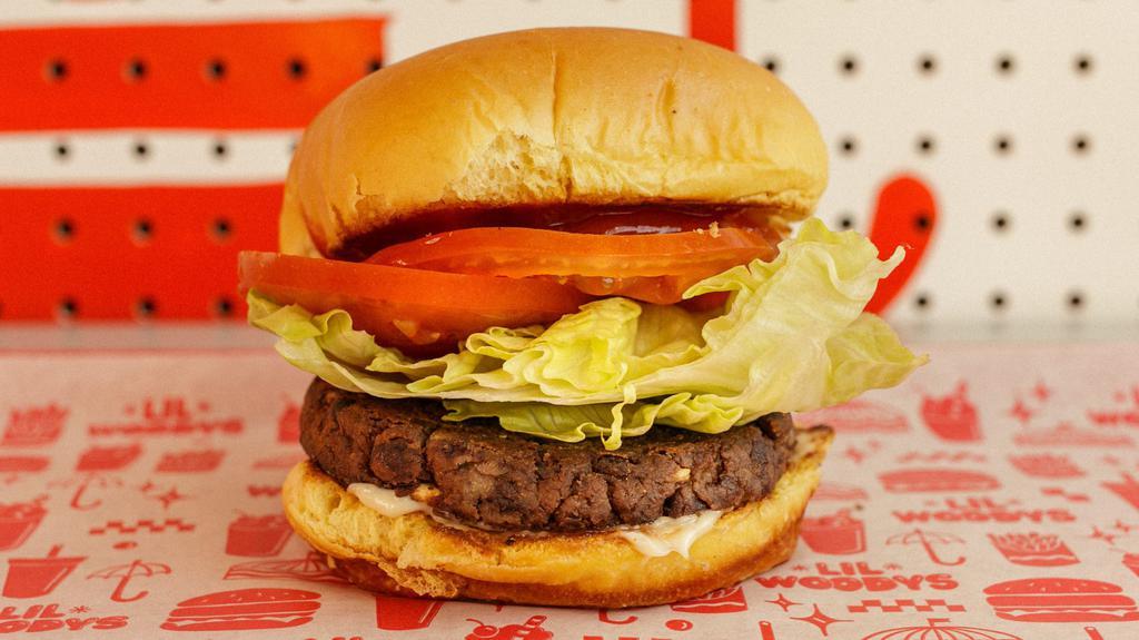 Veggie Veggie · House-made black bean veggie burger, diced pickles, chopped onions, tomato slices, lettuce, ketchup, mayo.