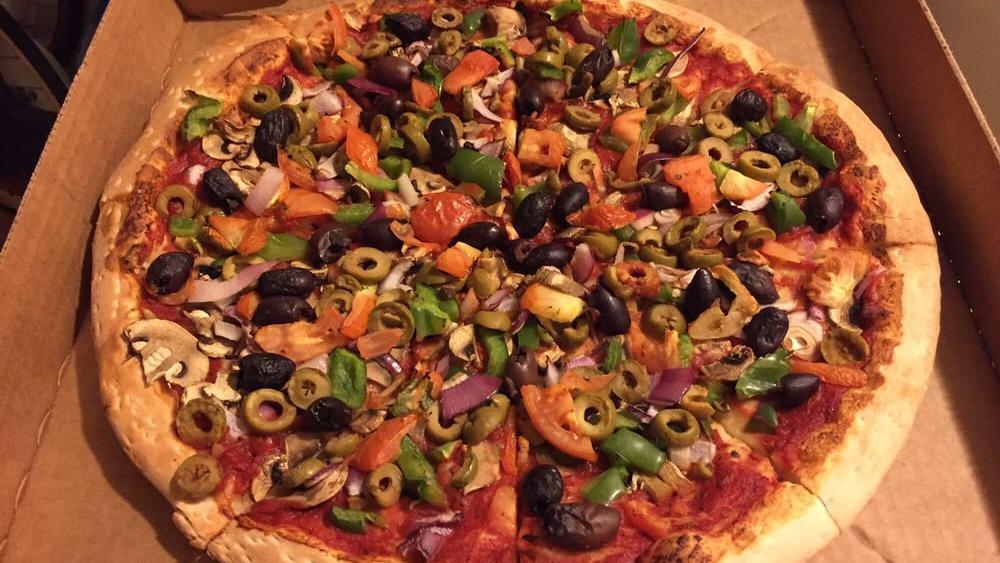 Veggie Works Pizza · Lots of mozzarella cheese plus tomatoes, fresh mushrooms, black and green olives, onions, and green peppers.