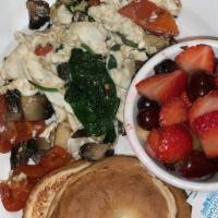 Vegetarian Scramble  · Sautéed portabella mushrooms, roasted red peppers, baby spinach and feta cheese scrambled wi...