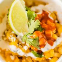 Pier St. Corn · Elote Style Corn off the cobb, cotija Mexican cheese grated, cilantro, ancho and valentina s...