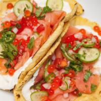 Smokin Salmon Taco · House smoked salmon, flour tortilla, pico, slaw, cilantro, Mexican Cheese, house sauce, mang...