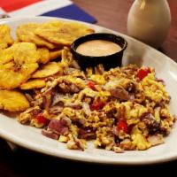 Scrambled Eggs With Tostones (Huevos) · Scrambled eggs with tomatoes, onions, peppers, and fried plantains.