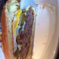 Hangover Burger · Fried egg, bacon, jalapenos and choice of cheese. Served on a brioche roll with fresh cut fr...