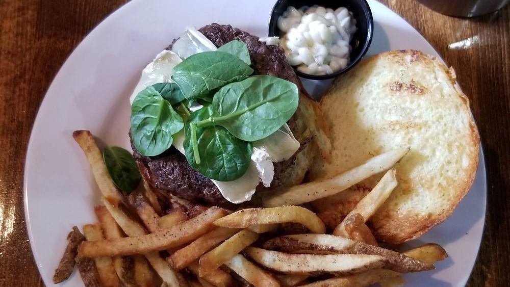 Frenchie Burger · Baby spinach, herbed mayonnaise and brie. Served on a brioche roll with fresh cut fries.