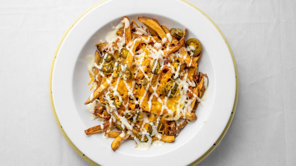 Texas Fresh Cut Fries · Bacon, cheese, jalapenos, green onion and ranch.
