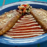 Poblano Portobello Quesadilla · Two corn masa quesadillas stuffed with roasted poblano chiles, portobello mushrooms, carmeli...