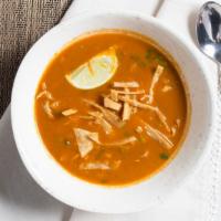 Puerto Nuevo-Style Tortilla Soup · Tortilla soup puerto nuevo style made with chicken stock, gaujillo chiles and roasted tomato...