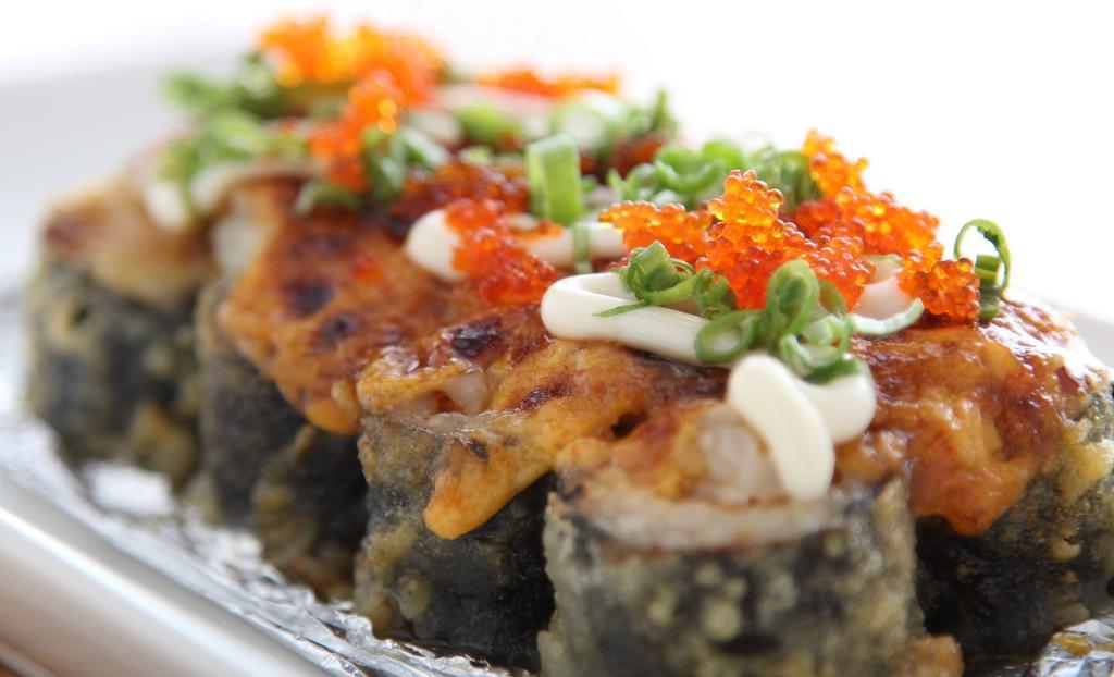 Lakeway Roll · deep fried spicy tuna roll, baked spicy scallop on top, mayo, masago, green onion