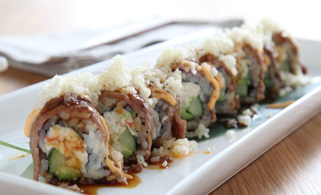 Austin Roll · California roll with beef and tempura flakes.