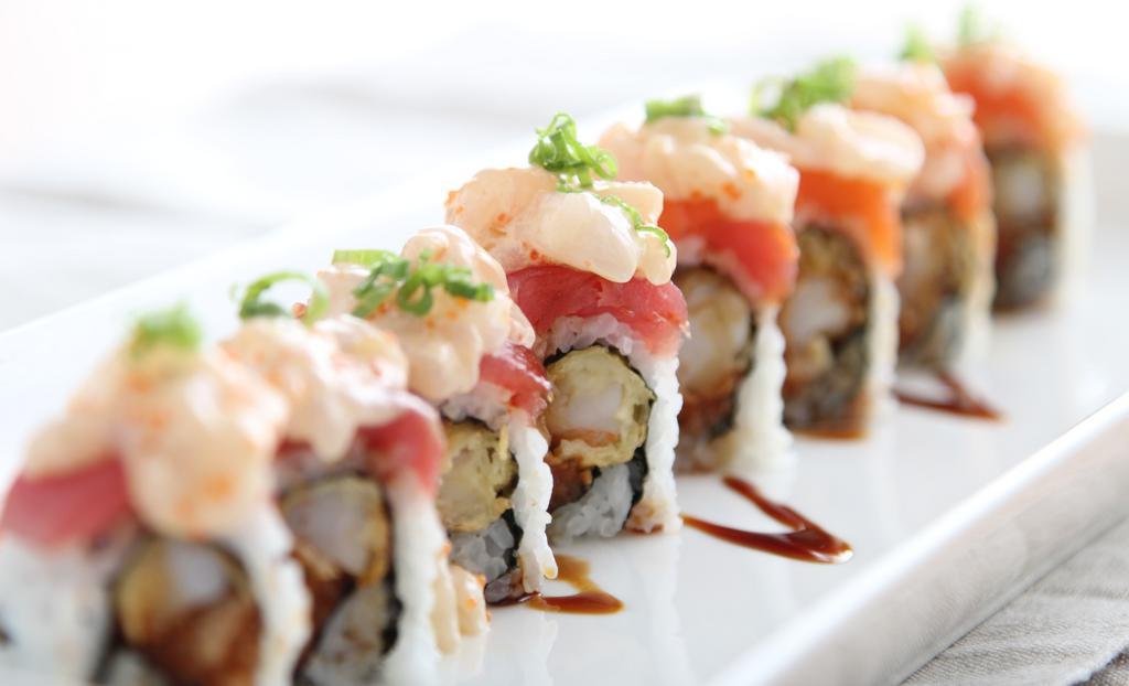 Scallop Lover Roll · spicy tuna and shrimp tempura inside, salmon, tuna and spicy scallop on top, tobiko, green onion