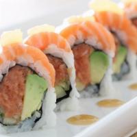 Tx Roll · spicy tuna, cucumber, avocado, topped with salmon, key lime, sweet miso, and spicy tomato sa...