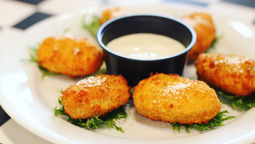 Jalapeno Poppers · Breaded jalapeño peppers stuffed with cheddar cheese flash fried and served with ranch.