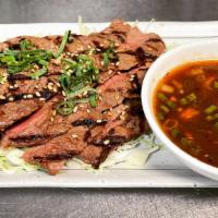 Grilled Beef · With  Spicy Tamarind Sauce.