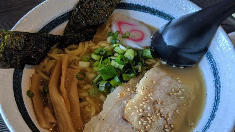 Shoyu Ramen · Tonkotsu (Pork) Broth with Soy Sauce Based Noodle Soup Topped with 2 Pieces of Chashu (Braised Pork), Green Onion, Bamboo, Naruto (Japanese Fish Cake), Nori (Seaweed)