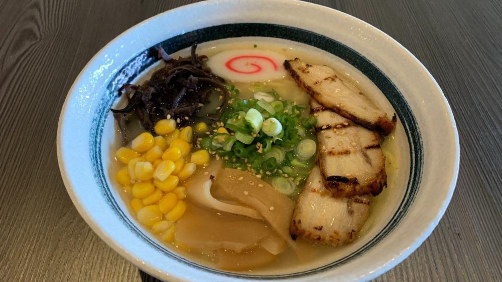 Shio Ramen · Tonkotsu (Pork) Broth with Salt Based Noodle Soup Topped with 2 Pieces of Chashu (Braised Pork), Green Onion, Bamboo, Naruto (Japanese Fish Cake), Corn