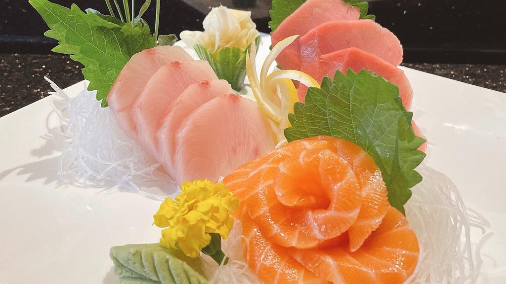 Sashimi Meal Set (12 Pcs) · 12 pieces of Salmon, Ono (White Tuna), and Yellowtail Served with Miso Soup, Salad, and Steamed Rice.
