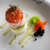 The Blue Fish Tower · Salmon or tuna tartare marinated in sesame oil over snow crab mix, avocado, sushi rice infus...