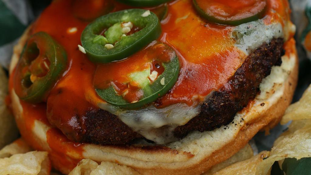 4 Alarm Burger · 1/2 lb brisket burger with Cajun seasoning then topped with pepper jack cheese, buffalo sauce and fresh jalapeño peppers.