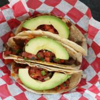Seasoned Beef Tacos · Seasoned ground beef with cheese blend, pico de gallo, refried beans and sliced avocado