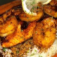 Blackened Cajun Shrimp & Salmon Cilantro Lime Rice /Honey Glazed Carrots · Grilled blackened salmon with  shrimp sautéed in-house Cajun seasoning served over a bed of ...