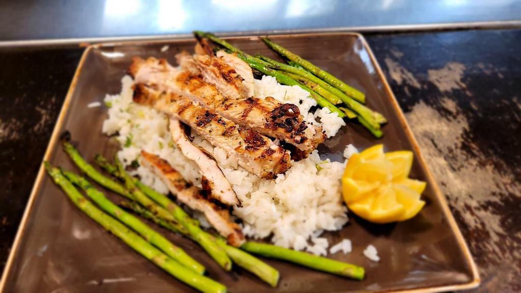 Rosemary Chicken And Grilled Asparagus · A fresh rosemary marinated grilled chicken breast served  with cilantro lime rice, grilled asparagus and topped with a white wine lemon butter