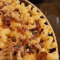 Mac-N-Cheese W/Brisket 8Oz  With Toasted Broccoli · Cavatappi pasta tossed with our house 4oz of smoked brisket and smoked  gouda cheese and oni...