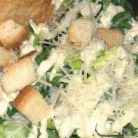 Caesar Salad · Fresh grilled romaine, fresh croutons, and  grated parmesan served with homemade Caesar dres...
