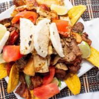Kanela'S Picada · Combination platter of grilled chicken, colombian chorizo, steak, chicharron, yuca, potatoes...