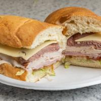 Deluxe Sandwich · Roast beef, ham, turkey, Swiss, lettuce, tomato, onions, mustard and mayonnaise on a subroll.
