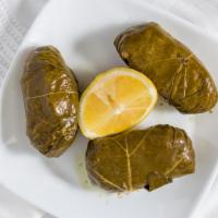 Dolmades · Three pieces. Ground beef and rice wrapped in grape leaves.