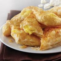Tiropita · Three pieces. Cheese and egg wrapped in phyllo.