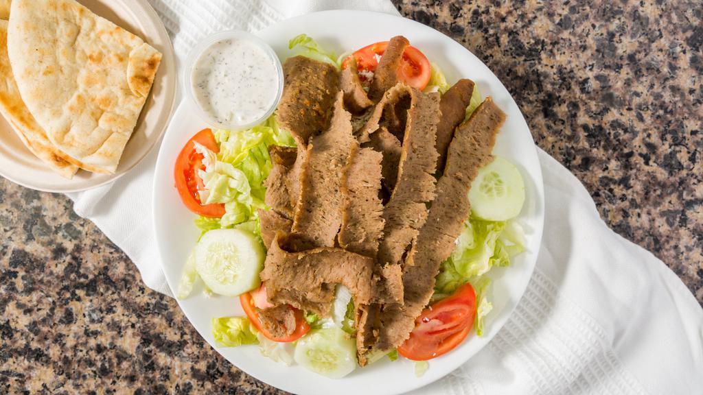 Special Plate · Large salad topped with gyro meat, pita bread, and tzatziki sauce.