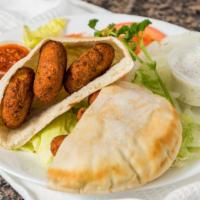 Falafel · Vegetarian patties served with onions, tomatoes, and hummus in pita bread with tzatziki
