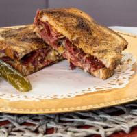 Reuben · Corned Beef with Saurkraut, russian dresing and melted swiss cheese on rye bread