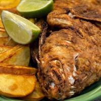 Pescado Boca Chica (Fried Fish) · Fried fish with your choice of tostones, french fries, or sweet potatoes fries.