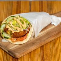 Falafel Wrap / Pita · Falafel patties, tomatoes, onions, cucumbers, sriracha tahini on your choice of whole wheat ...